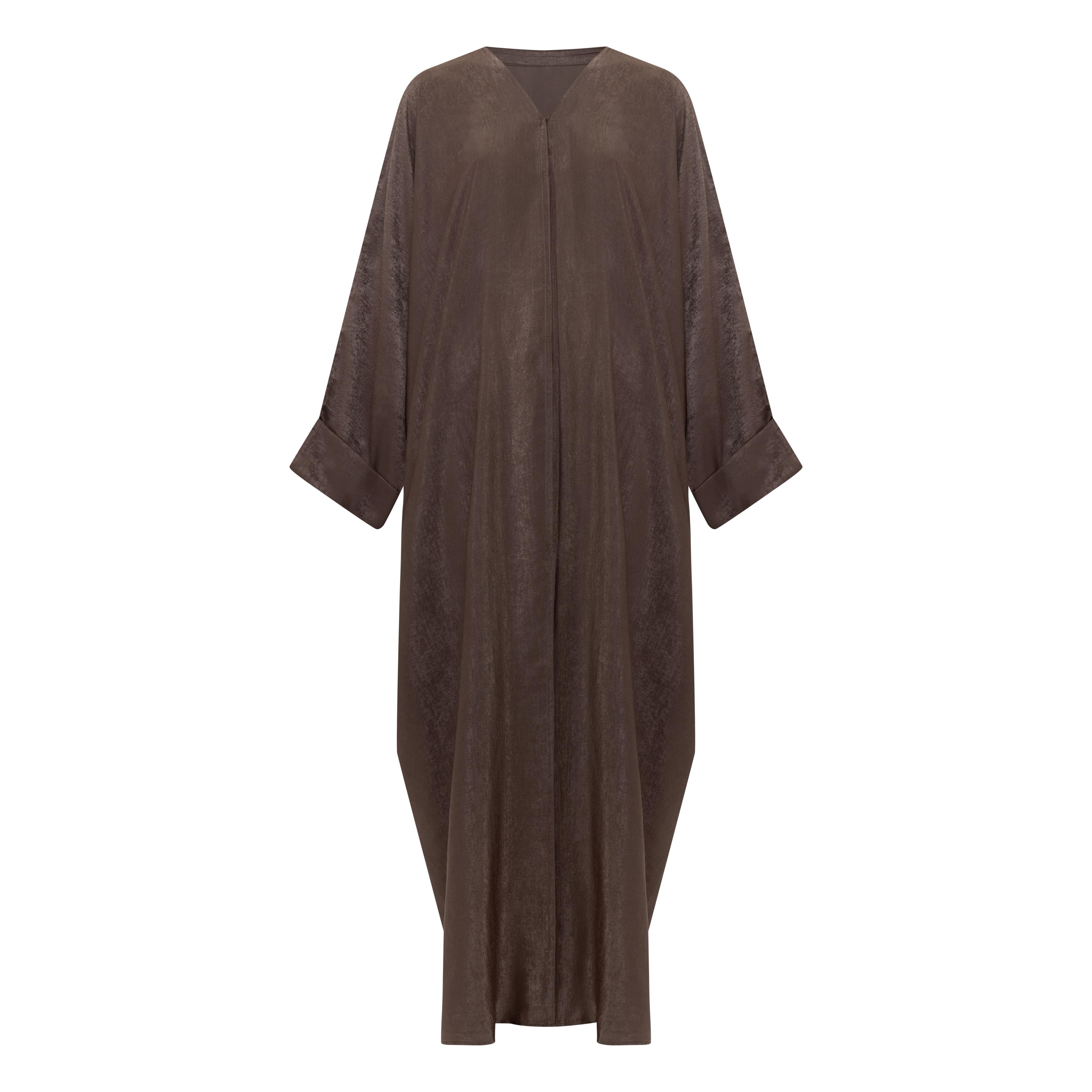 The Azeena Abaya, crafted from premium Farasha fabric, comes in five versatile shades and sizes 50-60, combining elegance with everyday comfort.