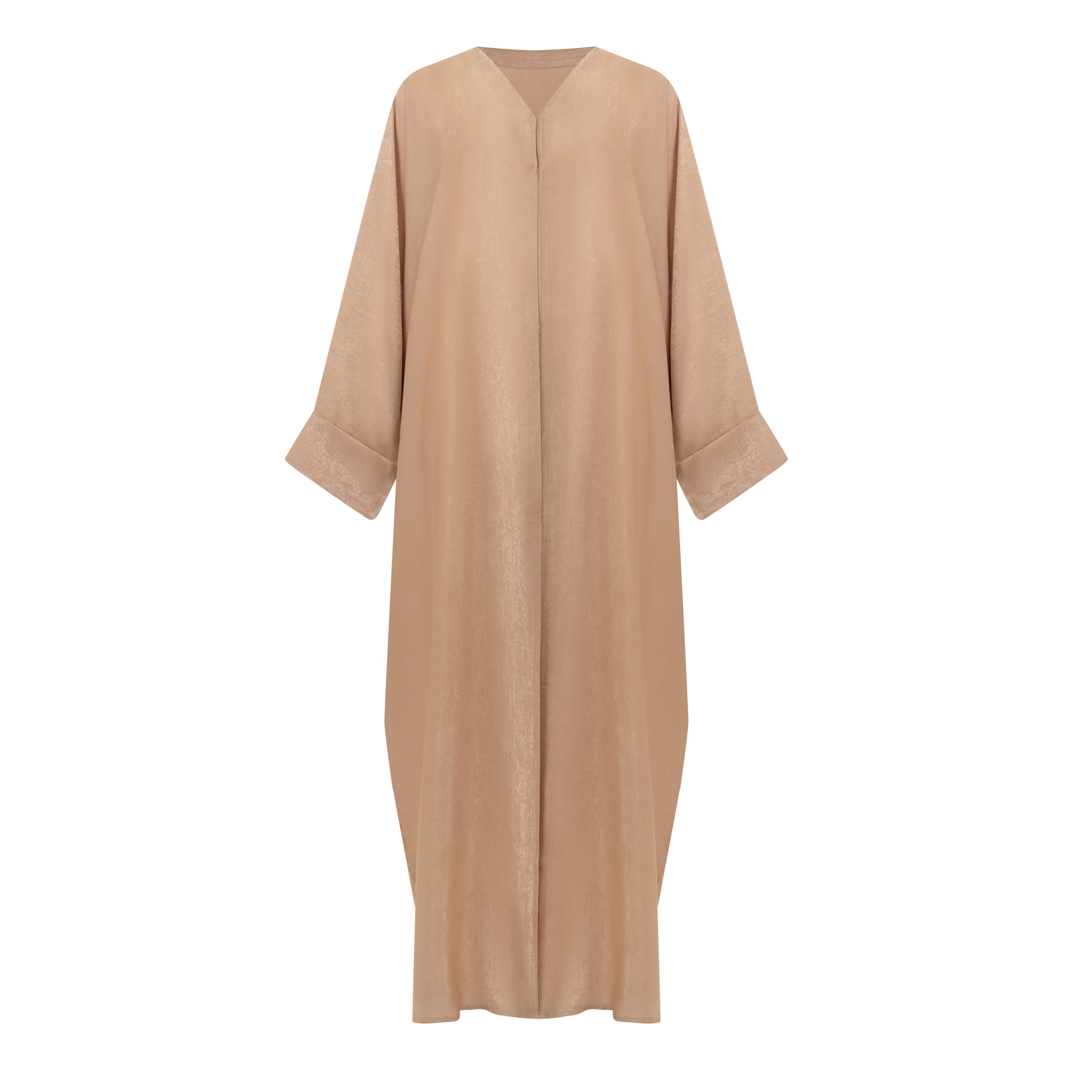 The Azeena Abaya, crafted from premium Farasha fabric, comes in five versatile shades and sizes 50-60, combining elegance with everyday comfort.