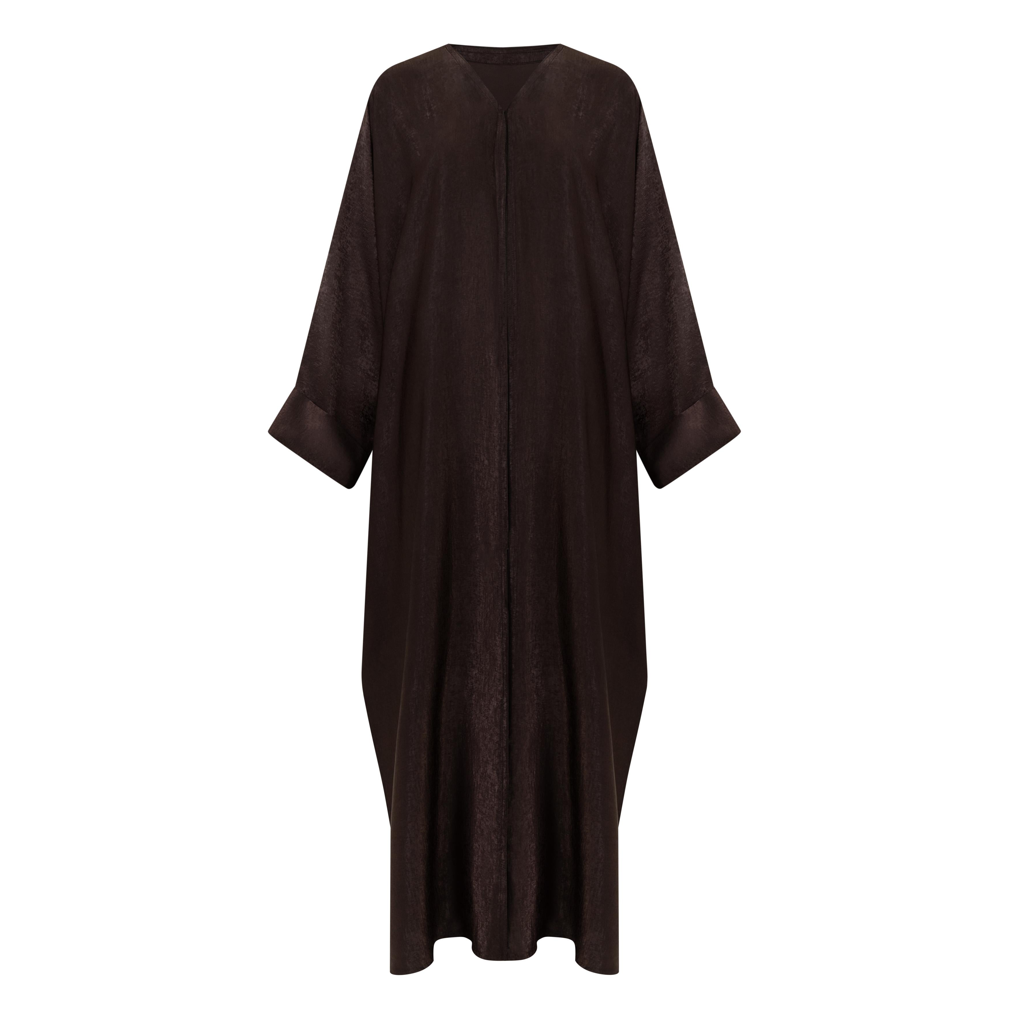 The Azeena Abaya, crafted from premium Farasha fabric, comes in five versatile shades and sizes 50-60, combining elegance with everyday comfort.