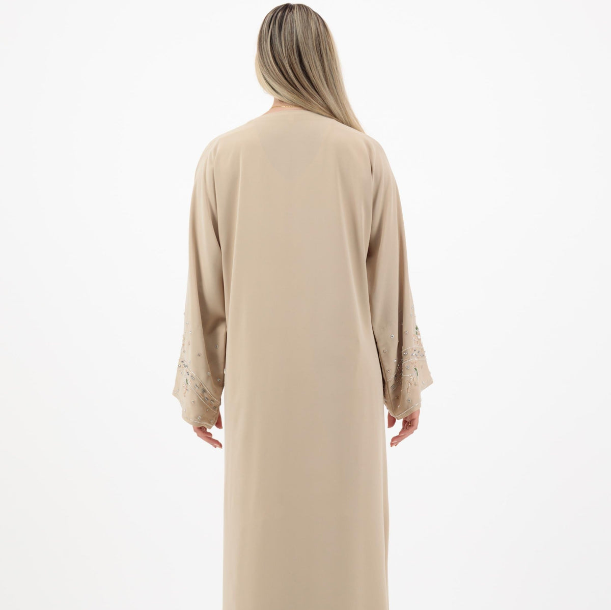 Reema Abaya available in Black, Vanilla, and Chocolate Brown with golden and silver beaded sleeves in a floral and leafy design. Made from crepe fabric with popper buttons, available in sizes 50-60. Includes a matching hijab.